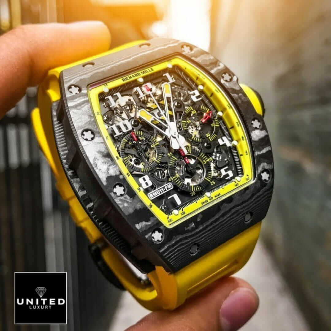 Richard Mille Black Bezel Yellow Bracelet Replica on the hand