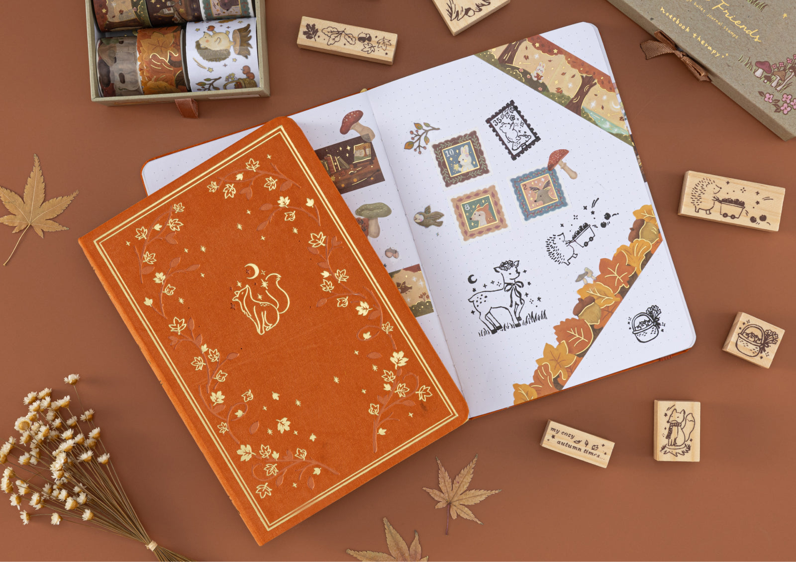 Forest Friends notebook and journal spread decorated with woodland animal stamps and autumn washi tape.