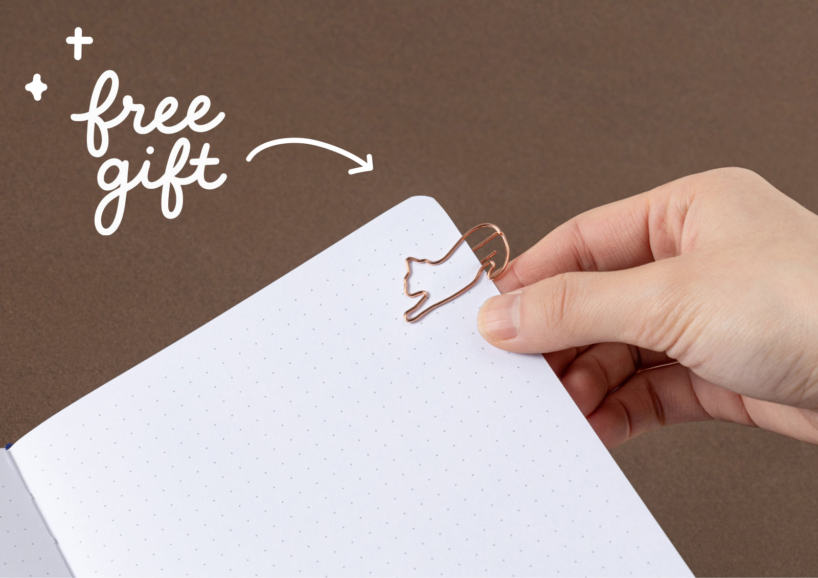 Free gold cat-shaped paper clip included with the Tsuki Neko Dreams Midnight Neko Notebook.
