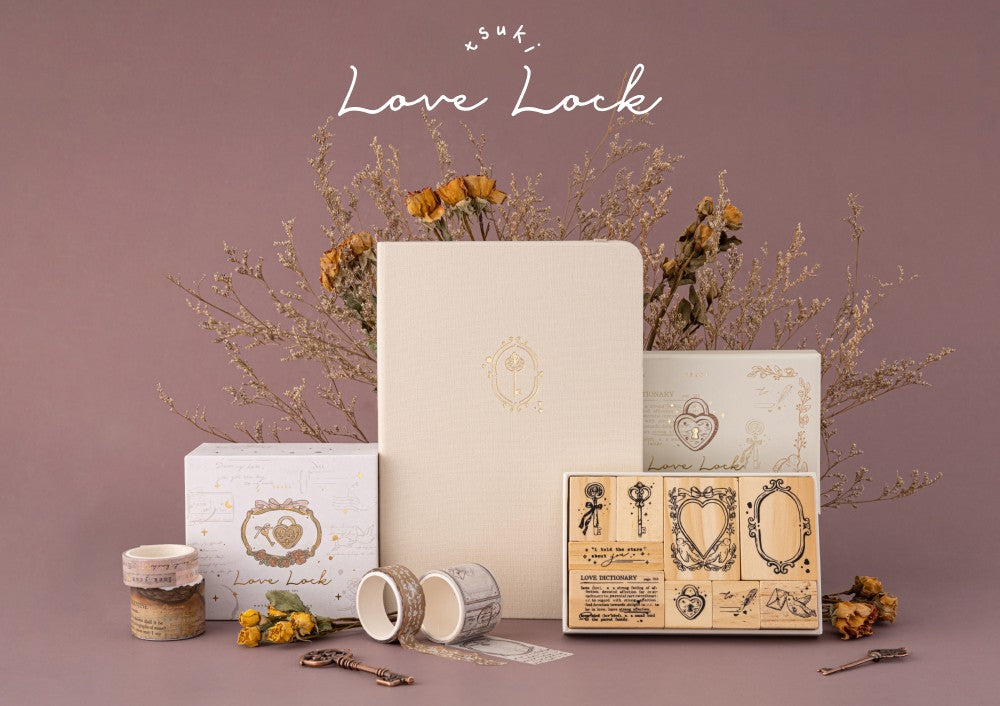 Tsuki Love Lock collection including key bullet journal, washi tape set and stamp set with flowers in the background