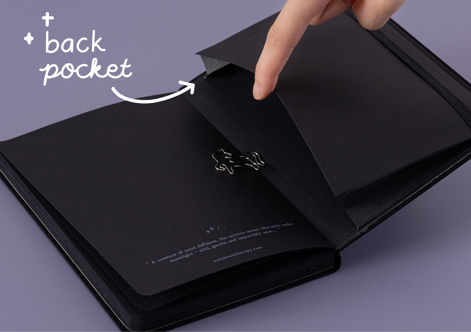 Tsuki Moonflower Magic Lunar Unicorn Notebook black edition styled flat lay with journaling props and pens.