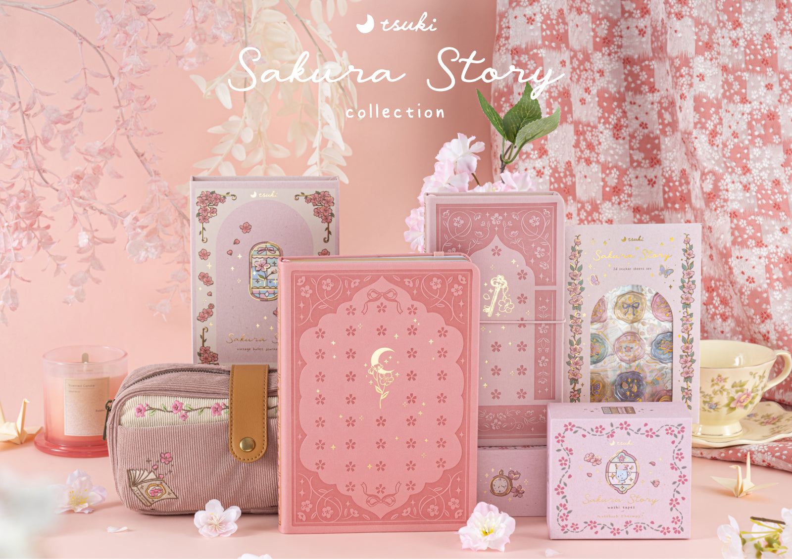 The Sakura Story collection featuring various journals, washi tape boxes, and a pencil case displayed with a teacup and floral accents.