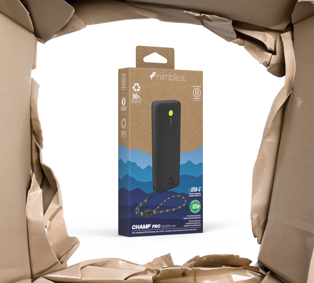 Boxed black power bank in eco-friendly packaging with torn paper.