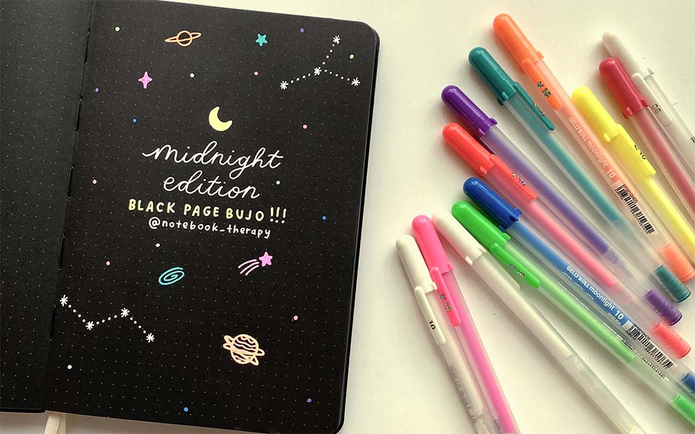 blackout book with doodles using sakura gelly roll moonlight set
