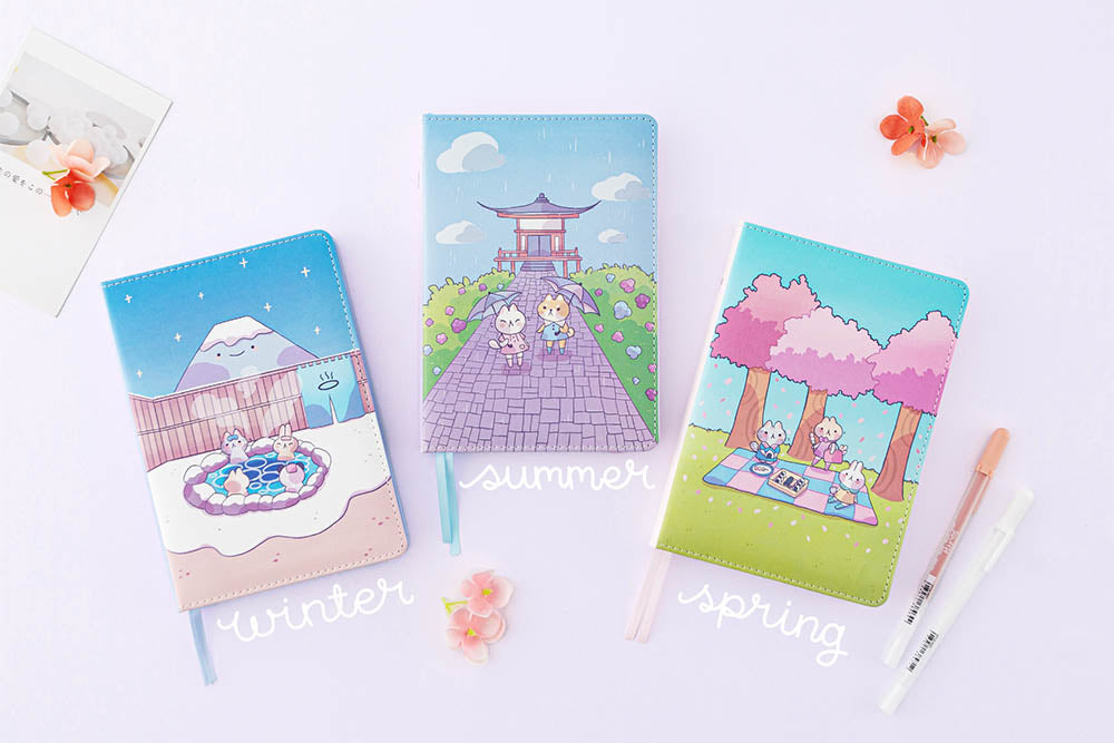 Tsuki Four Seasons Summer Edition and Spring Edition and Winter edition designed with @milkkoyo with flowers and postcard and pens on lilac background