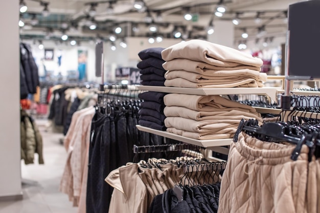 Premium Photo | A set of colored sweaters in the store on sale