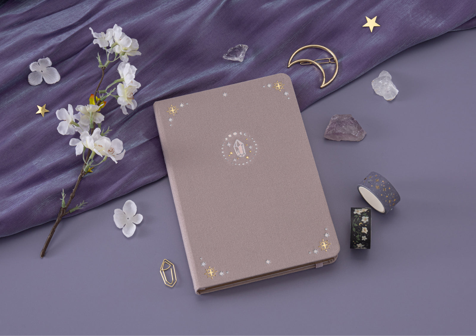 Detail shot of crystal-inspired foiled illustration on the Tsuki Moonflower Magic Crystal Magic Notebook cover.