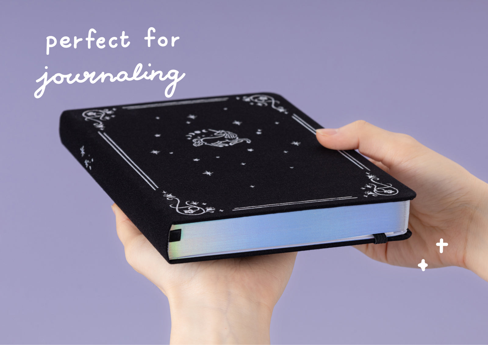 Open Tsuki Moonflower Magic Lunar Unicorn Notebook showing dotted grid pages for journaling.