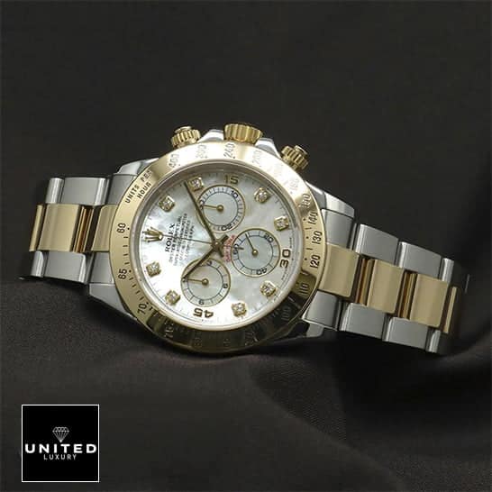 Rolex Daytona Two Tone White Dial 116523 Replica on the black table