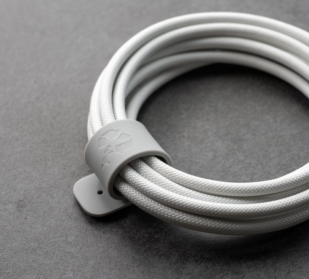White cable securely wrapped with cable management strap.