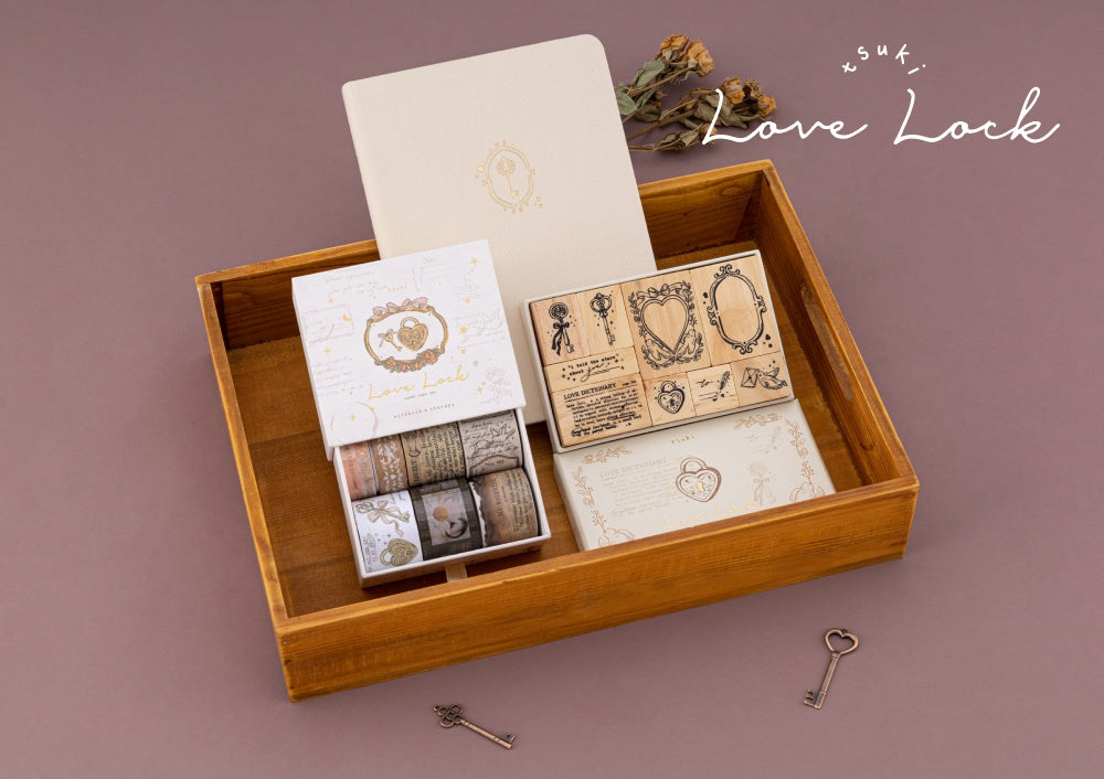 Notebook Therapy Love Lock notebook with Love Lock washi tape and stamps in a wooden tray