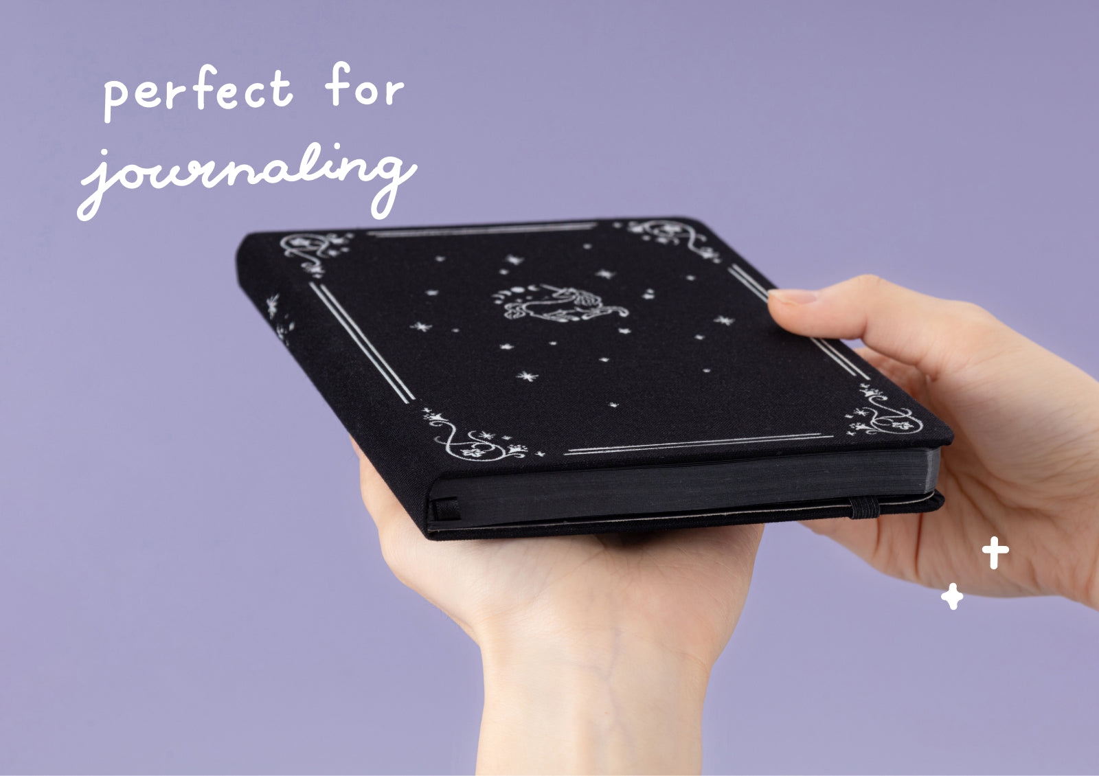 Open Tsuki Moonflower Magic Lunar Unicorn Notebook black edition showing dotted grid pages for journaling.