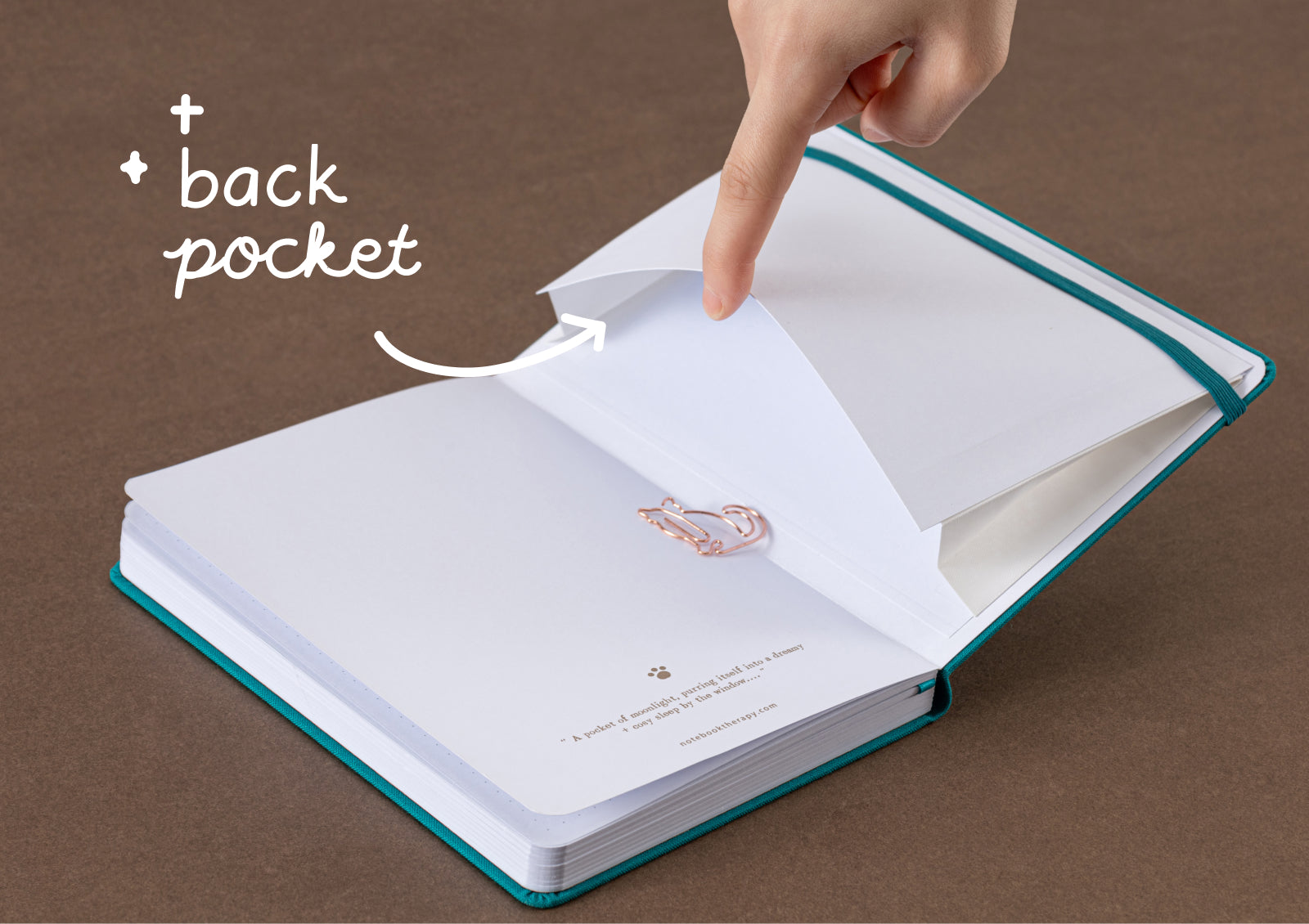 Tsuki Neko Dreams Sleepy Neko Notebook open to dotted pages with dual turquoise ribbon bookmarks.