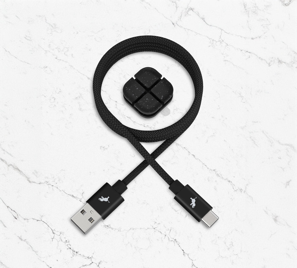 USB to USB-C cable and magnetic holder on a marble surface.