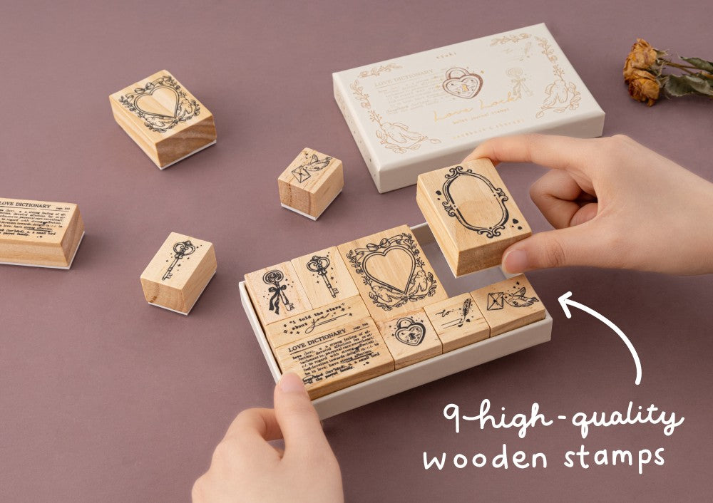 Hand taking out frame stamp from Love Lock stamp set with text 9 high quality wooden stamps