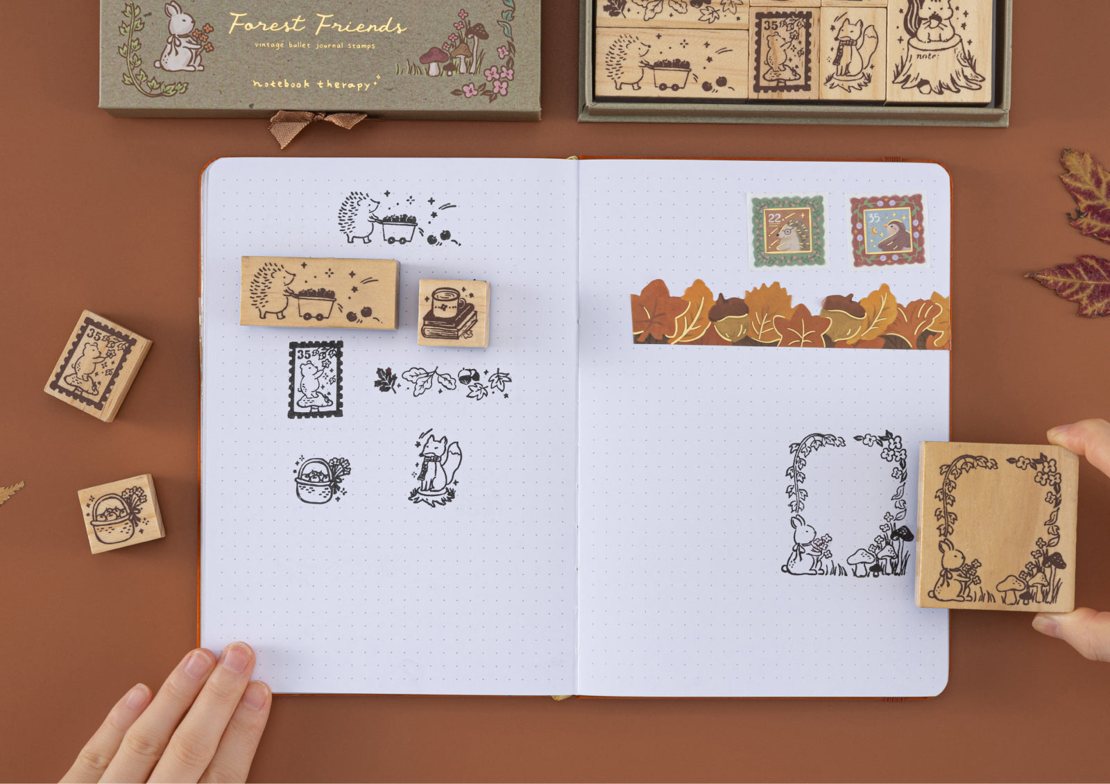 Forest Friends stamps pressed into a bullet journal, creating pages with cute woodland animals and leaves.