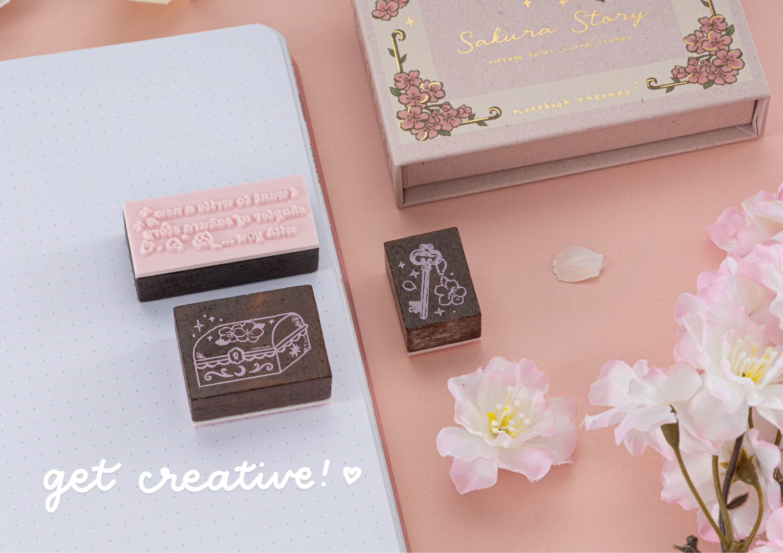 Close-up of three individual wooden stamps featuring a treasure chest, a key, and a poetic script block.