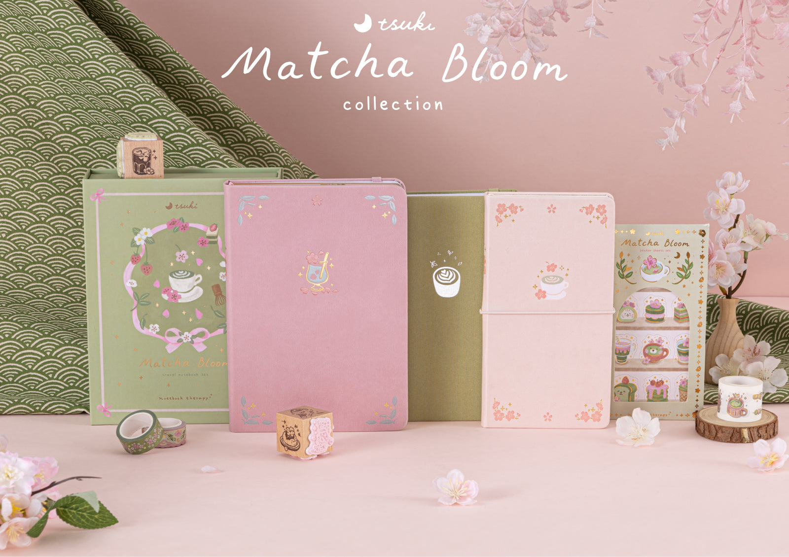 An open Matcha Bloom notebook decorated with themed stickers and washi tape next to a cup of green tea.