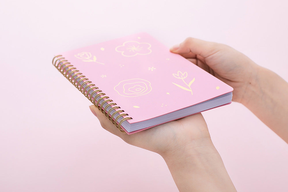 Tsuki Floral collection 3 ringbound bujos laid out on pink background