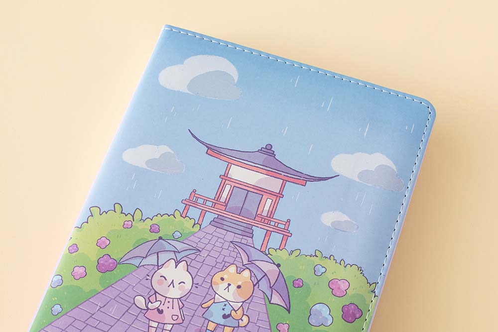 Close up of the front cover of Tsuki Four Seasons: Summer Edition Bullet Journal designed with @milkkoyo on honey yellow background