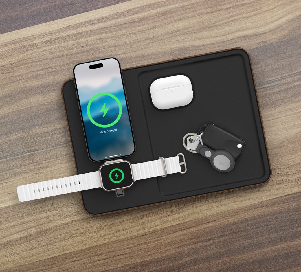 Wireless charging pad with Apple devices, AirPods, and keys.