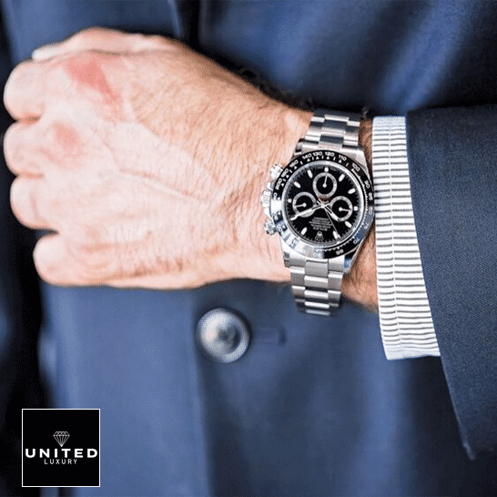 the man in the suit has a Rolex Daytona 116500ln-0002 Replica