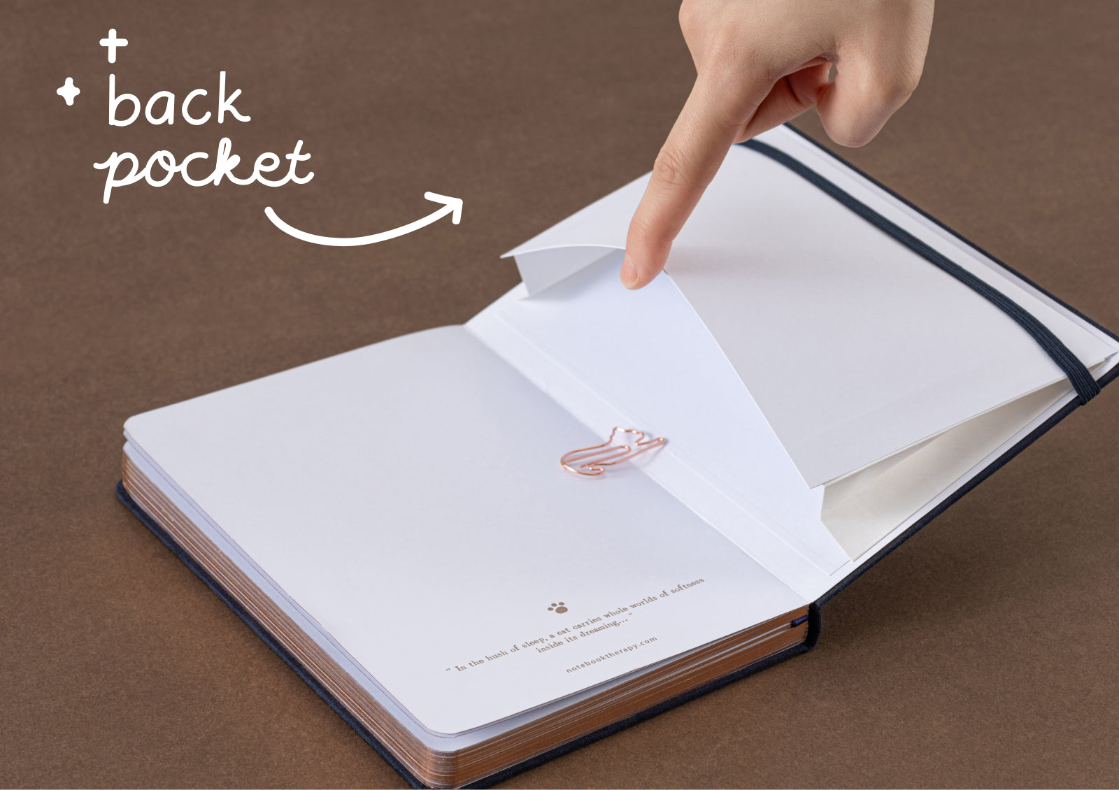 Tsuki Neko Dreams Midnight Neko Notebook open to dotted pages with dual navy ribbon bookmarks.