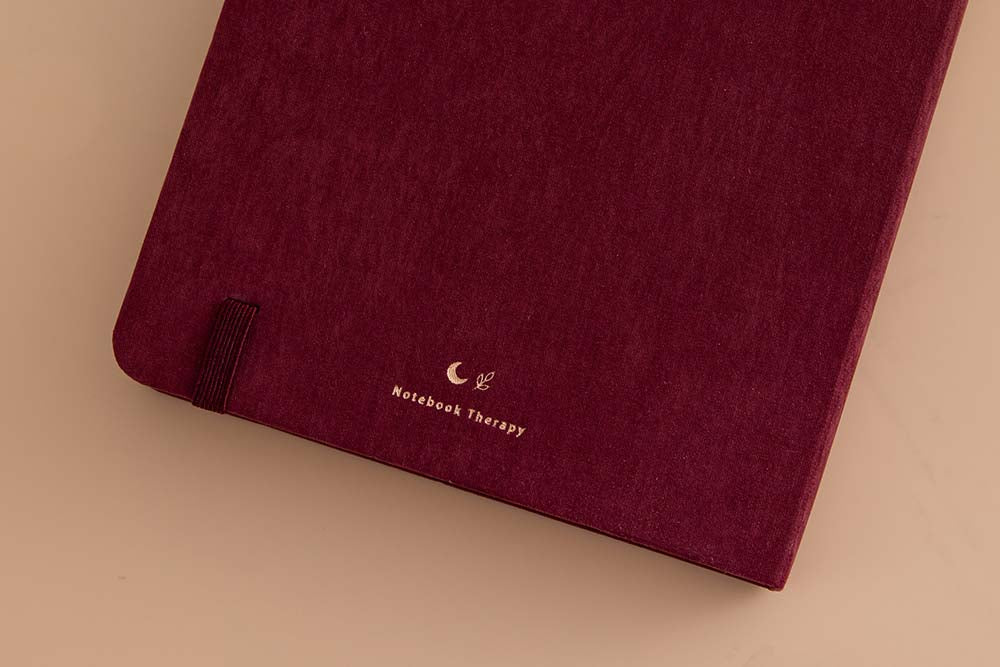 Close up of back cover of Tsuki ‘Kinoko’ Limited Edition Bullet Journal on beige background