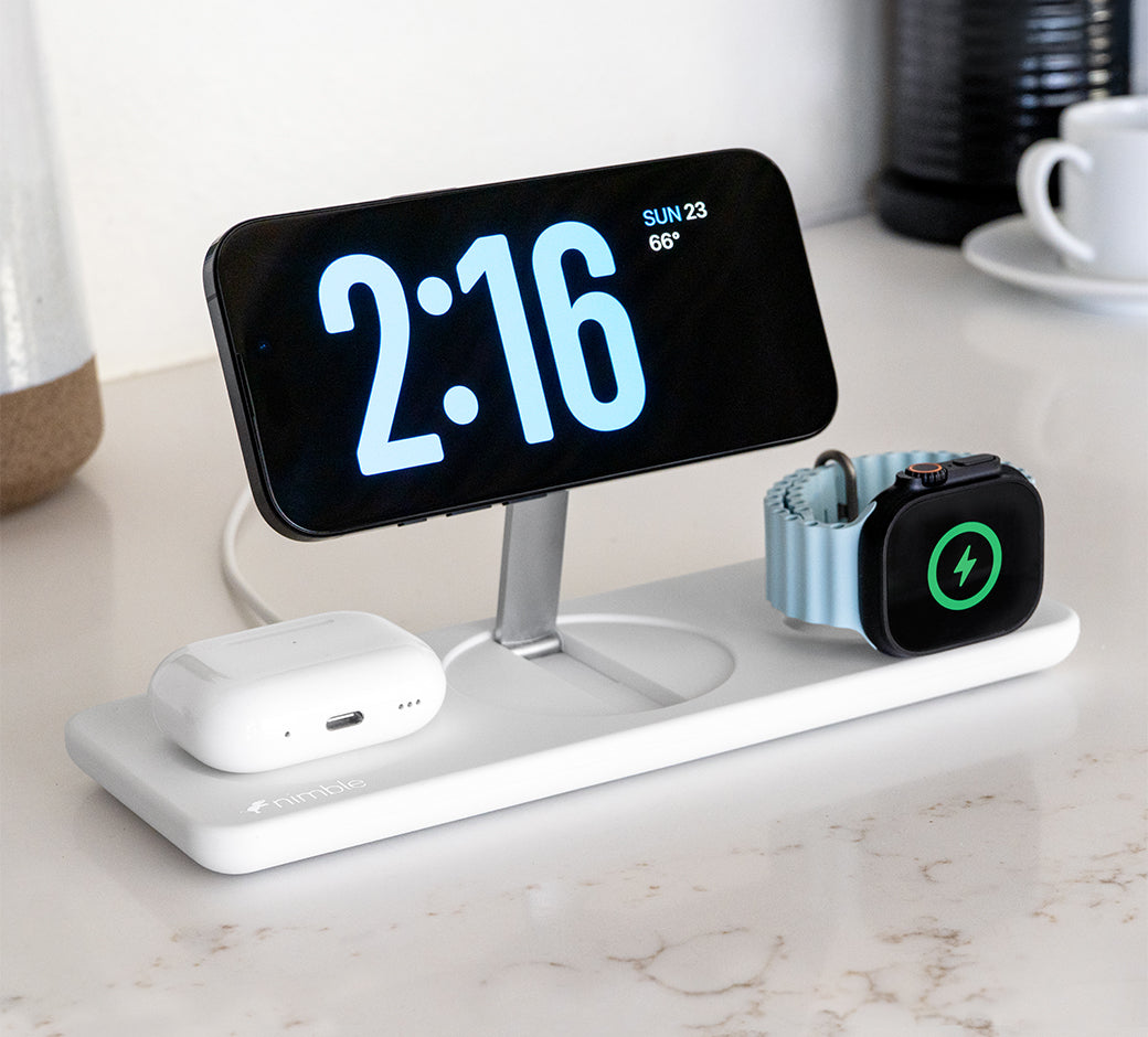 Phone and watch charging station with clear display of phone and watch.