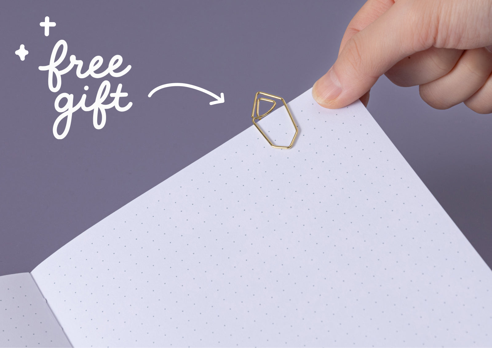 Hands opening the Tsuki Moonflower Magic Crystal Magic Notebook, revealing dotted grid pages inside.