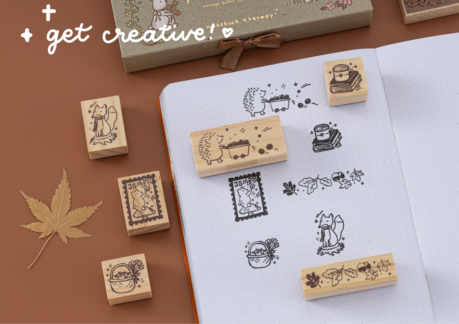 Assorted Forest Friends wooden stamps being used in a journal, encouraging creativity with animal and autumn designs.